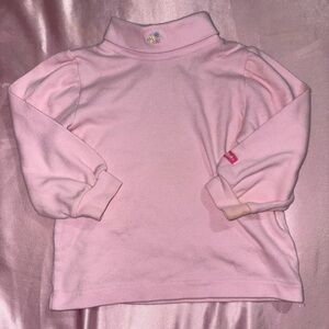 pink turtleneck